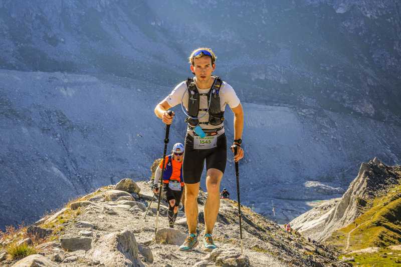 me running up the final stretch toward Panossiere with the sun starting to set behind the ridge